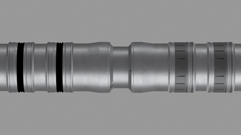 Rendered view of a Welltec downhole completion tool showing seals and grooved components for wellbore isolation.