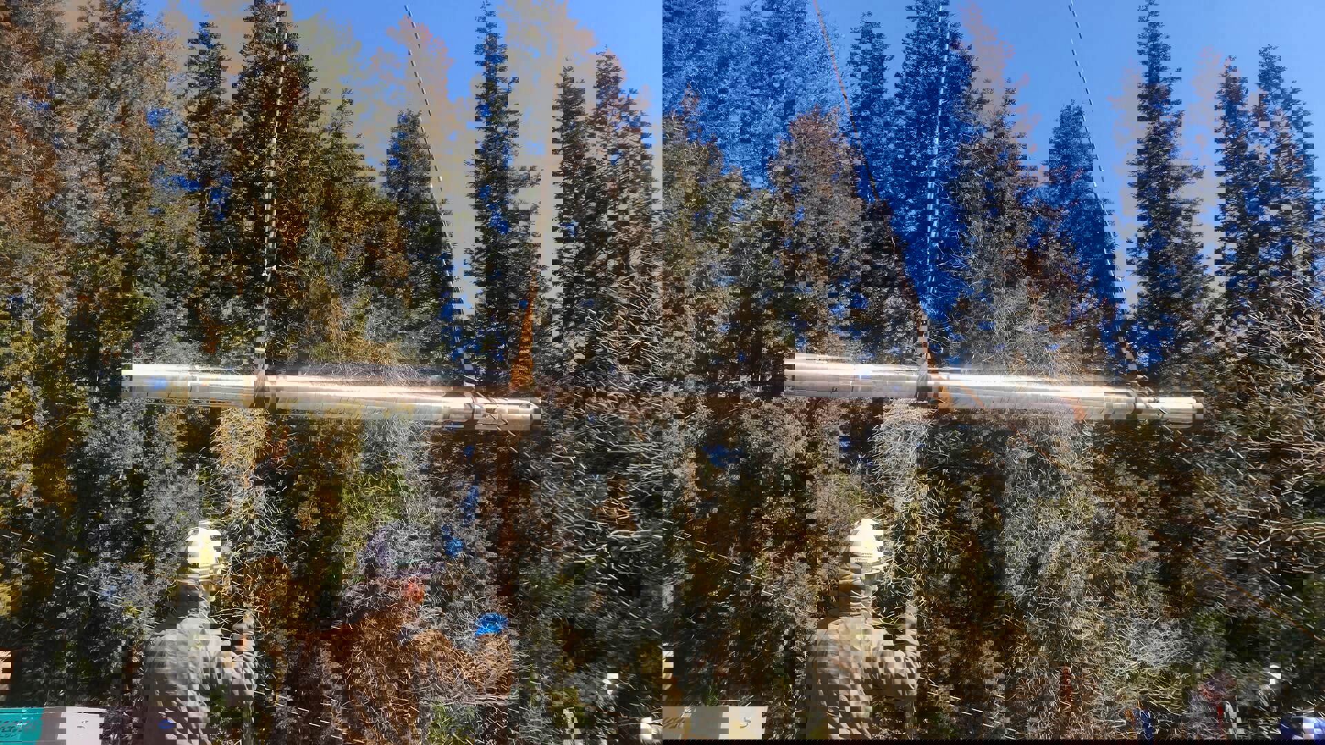 A man holds a large pipe aloft, showcasing the WEA Inner String design in a dynamic pose.