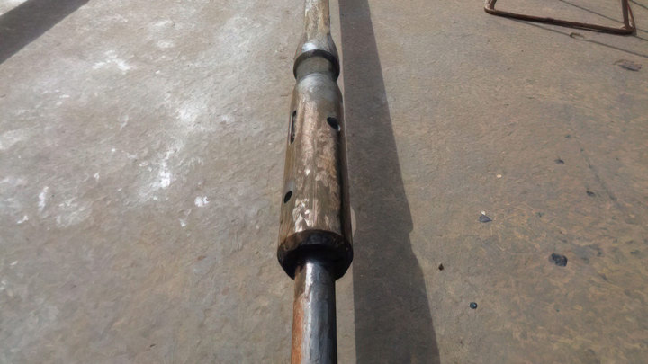 Wellgrab fishing tool with a worn surface, used for efficient downhole operations, showcasing its robust design for extracting stuck objects.