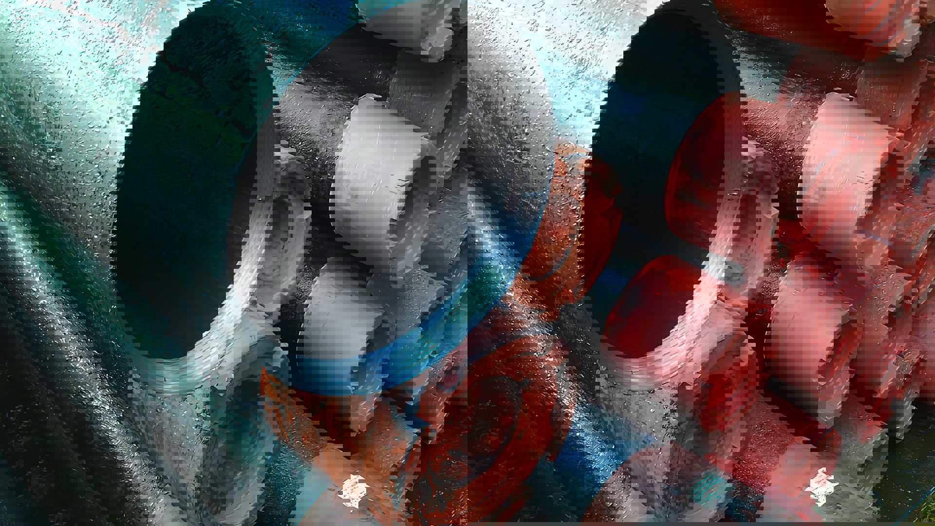 Stack of pipes with protective caps, typically used in plug and abandonment operations in the oil and gas industry.