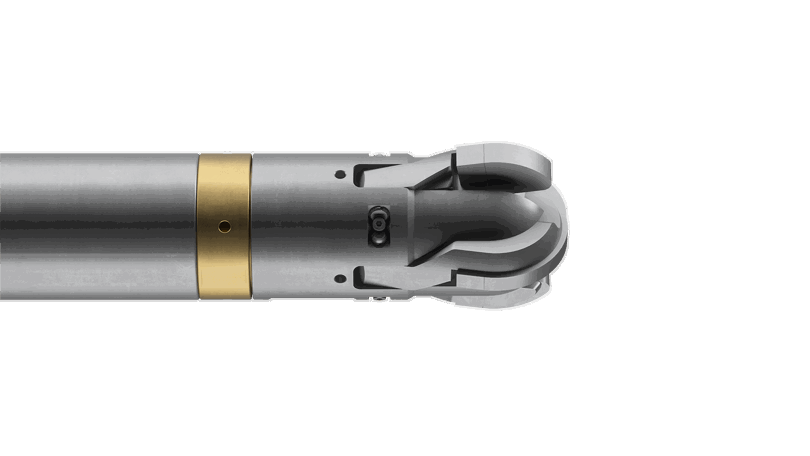 Close-up view of a Welltec tool with a metallic gray body, gold-colored section, and precision-engineered head for downhole operations.