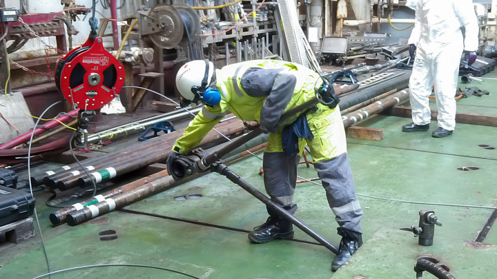 Technician operates the Well Cleaner Power Suction Tool during a cleanout operation.