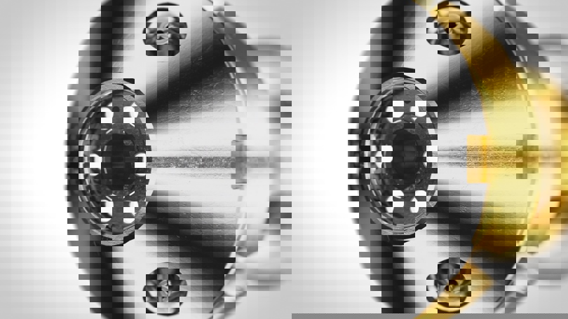 Close-up of Welltec Streamview Pro tool with a metallic body, gold-colored section, and precision holes for downhole imaging and operations.