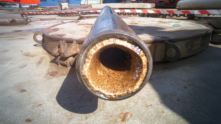Close-up of a production tubular with hard scale buildup inside, following milling operations offshore Norway