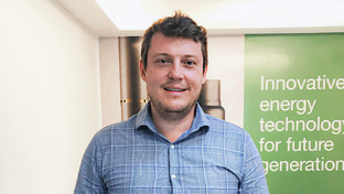 Pedro Henrique Garcia Bazan, Sales Director – Well Completions, standing in front of a Welltec display on innovative energy technology.