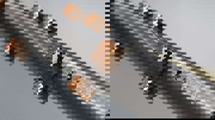 Close up of a gas lift valve GLV component showing detailed metallic structure